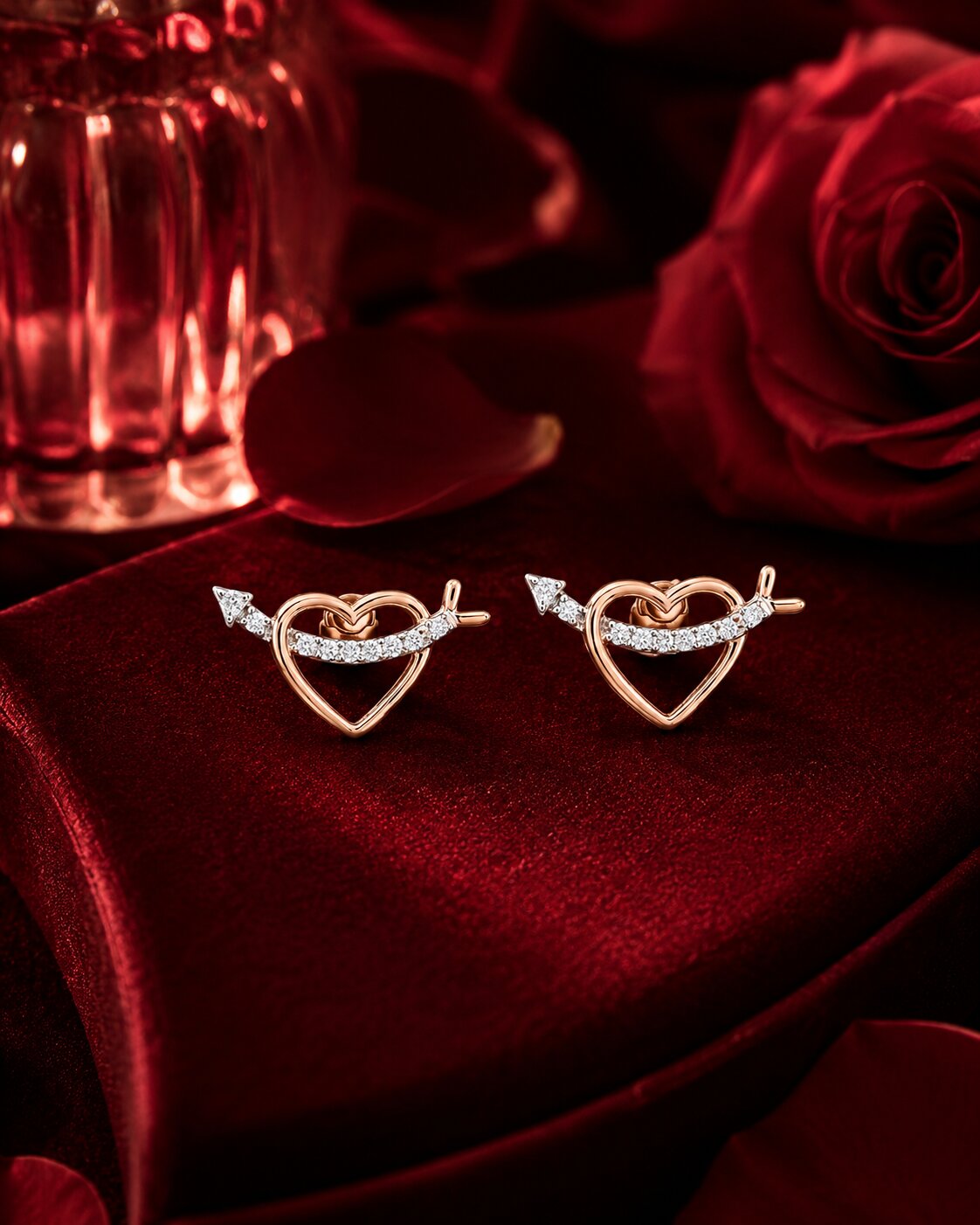 Cupid heart diamond earrings in rose gold on red velvet box, luxury Firefly Diamonds jewellery campaign.