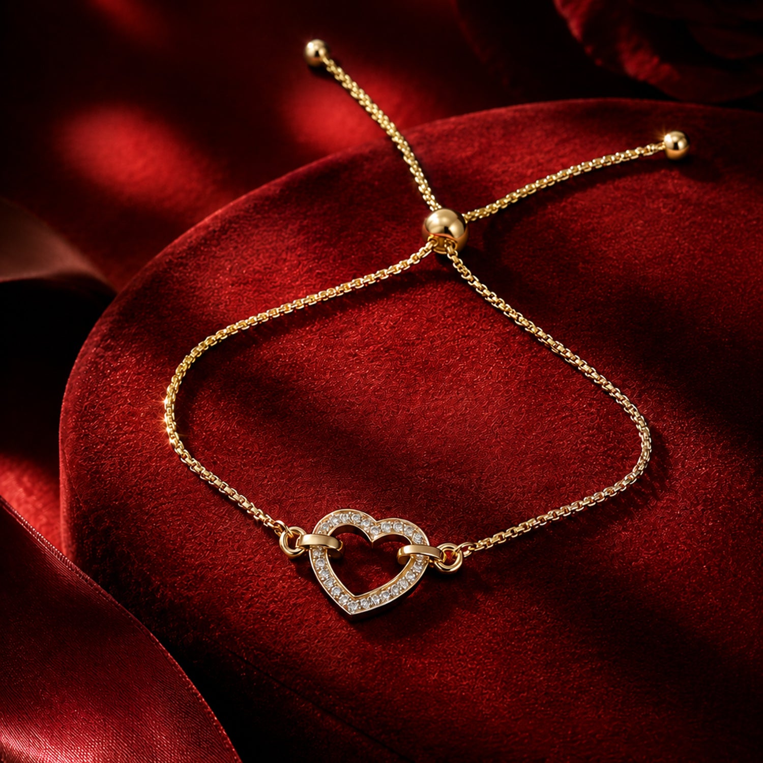 Heart-shaped lab-grown diamond bracelet in yellow gold on red velvet cushion, luxury Firefly Diamonds jewellery campaign photography.