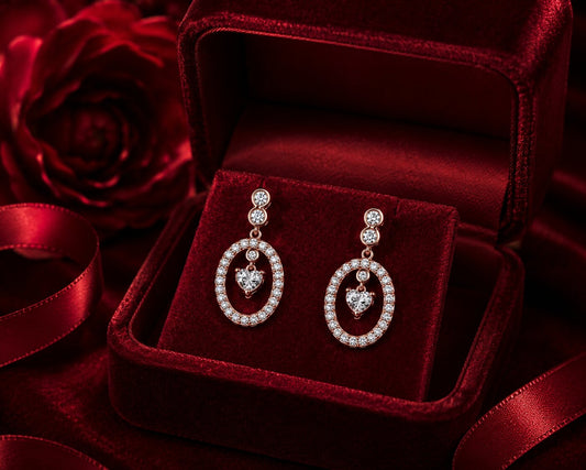 Heart drop diamond earrings in rose gold with luxury velvet jewellery box.