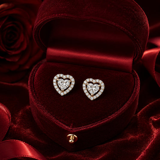 Heart halo diamond stud earrings in gold with luxury red velvet jewellery box.