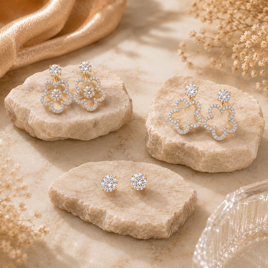 Three-way floral diamond earrings on marble display