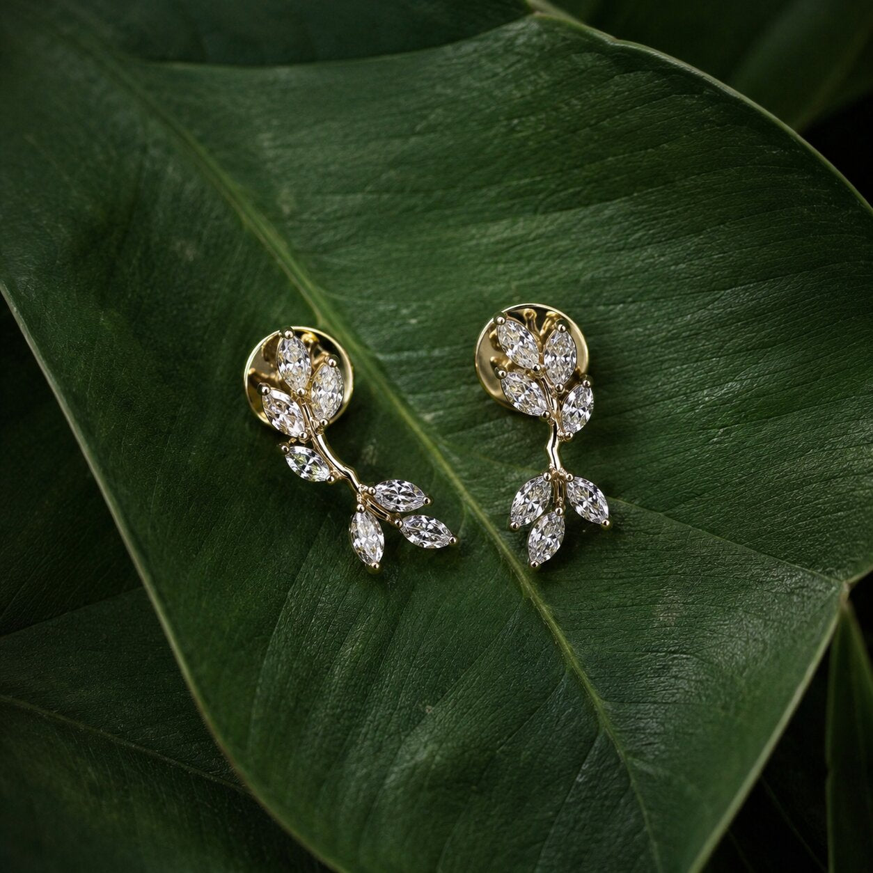 Elegant floral diamond stud earrings in gold with nature-inspired leaf motif