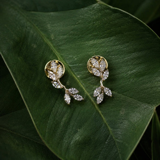 Elegant floral diamond stud earrings in gold with nature-inspired leaf motif