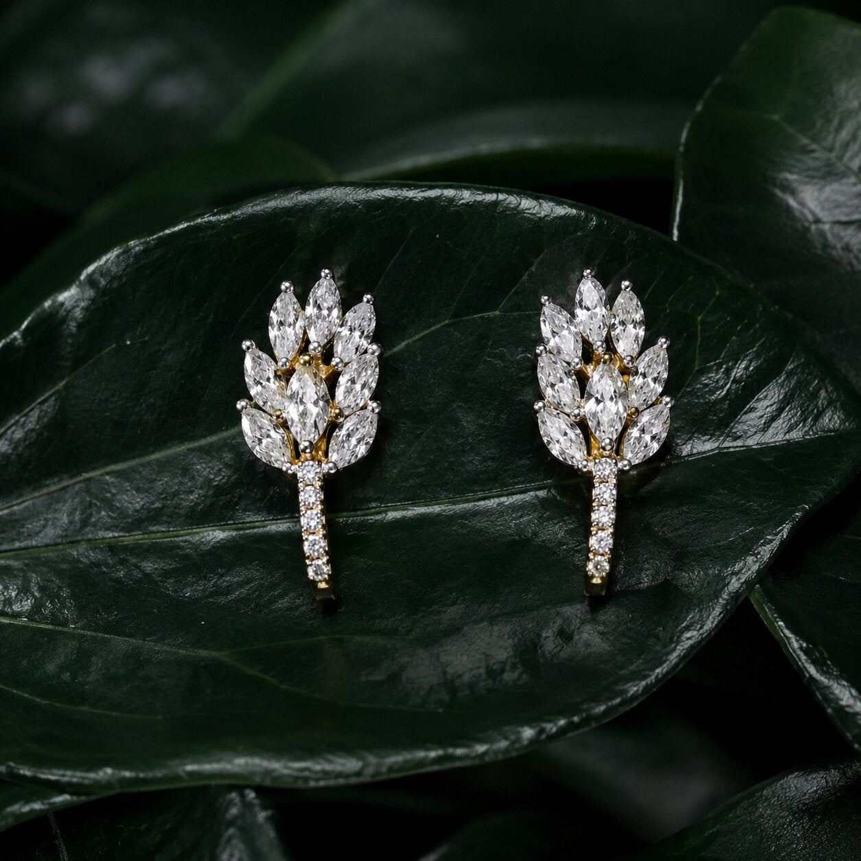 Botanical diamond statement earrings with marquise-cut diamonds on glossy green leaves