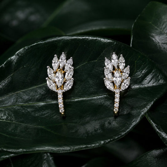 Botanical diamond statement earrings with marquise-cut diamonds on glossy green leaves
