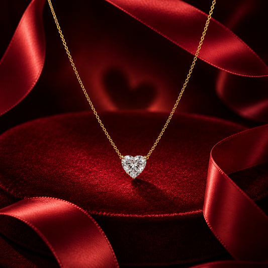 Solitaire heart diamond pendant necklace in yellow gold with luxury red satin and velvet styling