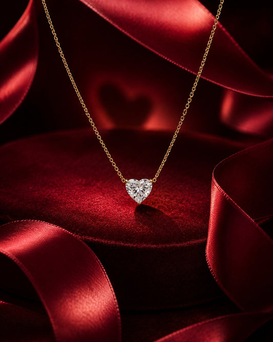 Solitaire heart diamond pendant necklace in yellow gold with luxury red satin and velvet styling