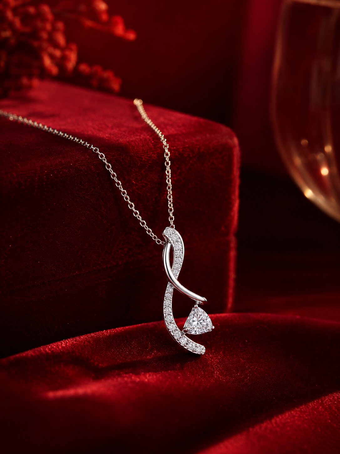 White gold lab-grown diamond pendant necklace on deep red velvet fabric, cinematic luxury jewellery photography by Firefly Diamonds.