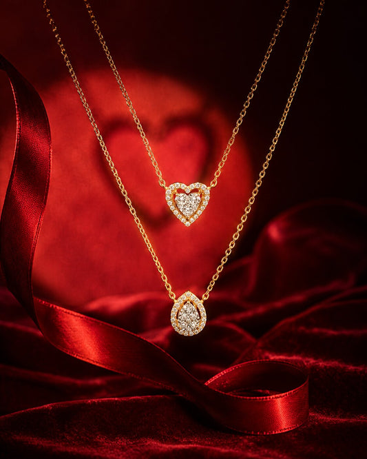 Double heart diamond pendant necklace on velvet cushion with silk ribbons