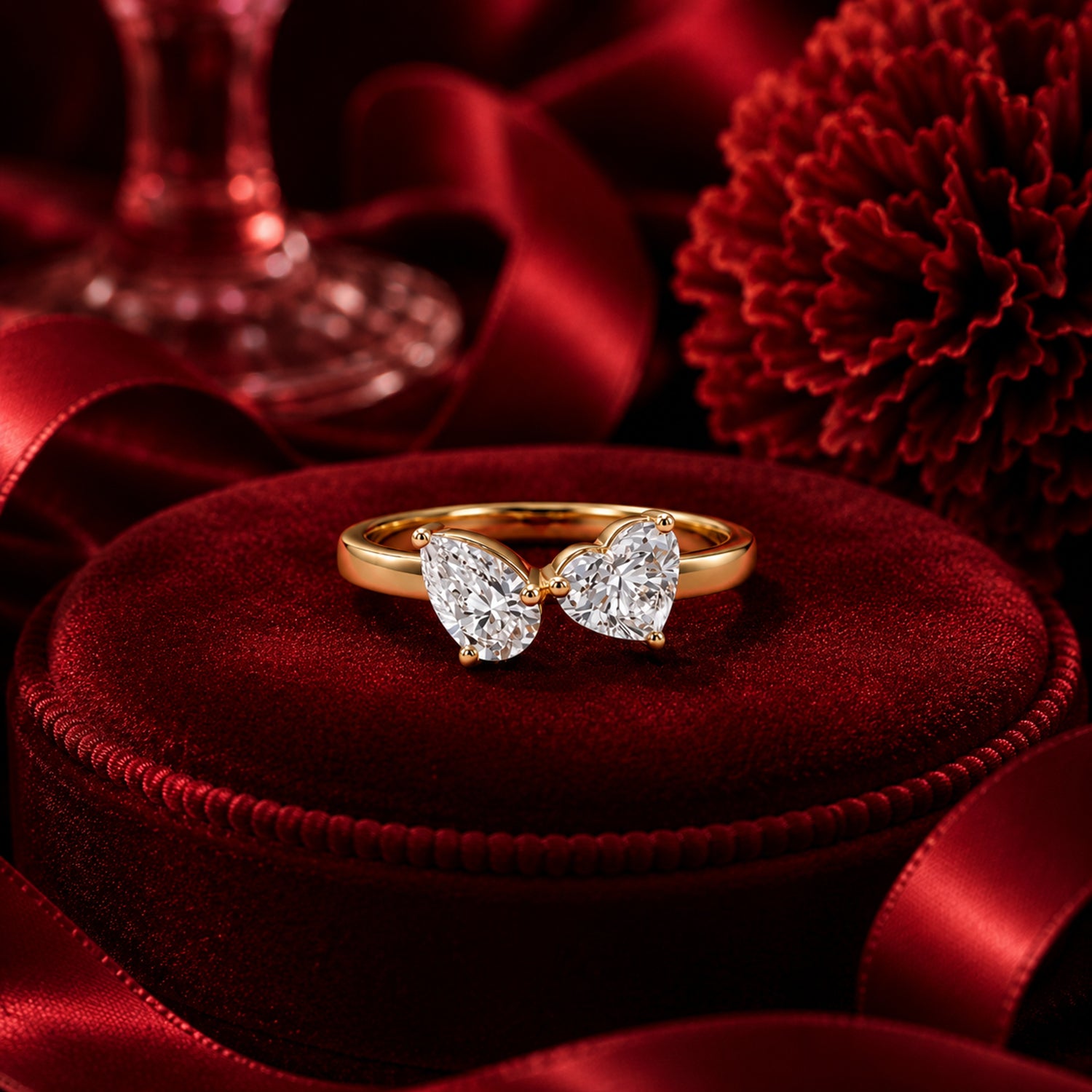 Double heart-shaped lab-grown diamond ring in yellow gold on crimson velvet, luxury Firefly Diamonds ring photography