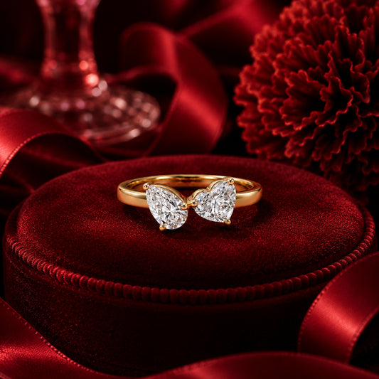 Double heart-shaped lab-grown diamond ring in yellow gold on crimson velvet, luxury Firefly Diamonds ring photography