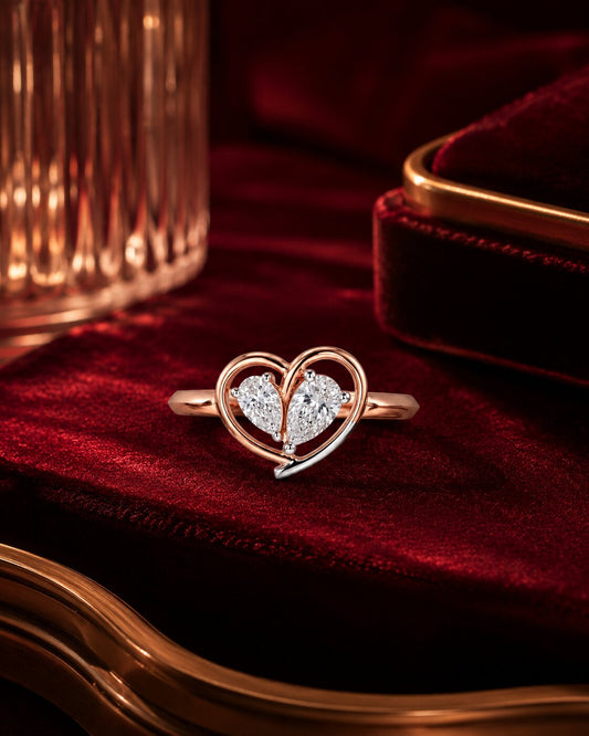 Heart-shaped lab-grown diamond ring in rose gold on crimson velvet, luxury romantic jewellery photography by Firefly Diamonds.