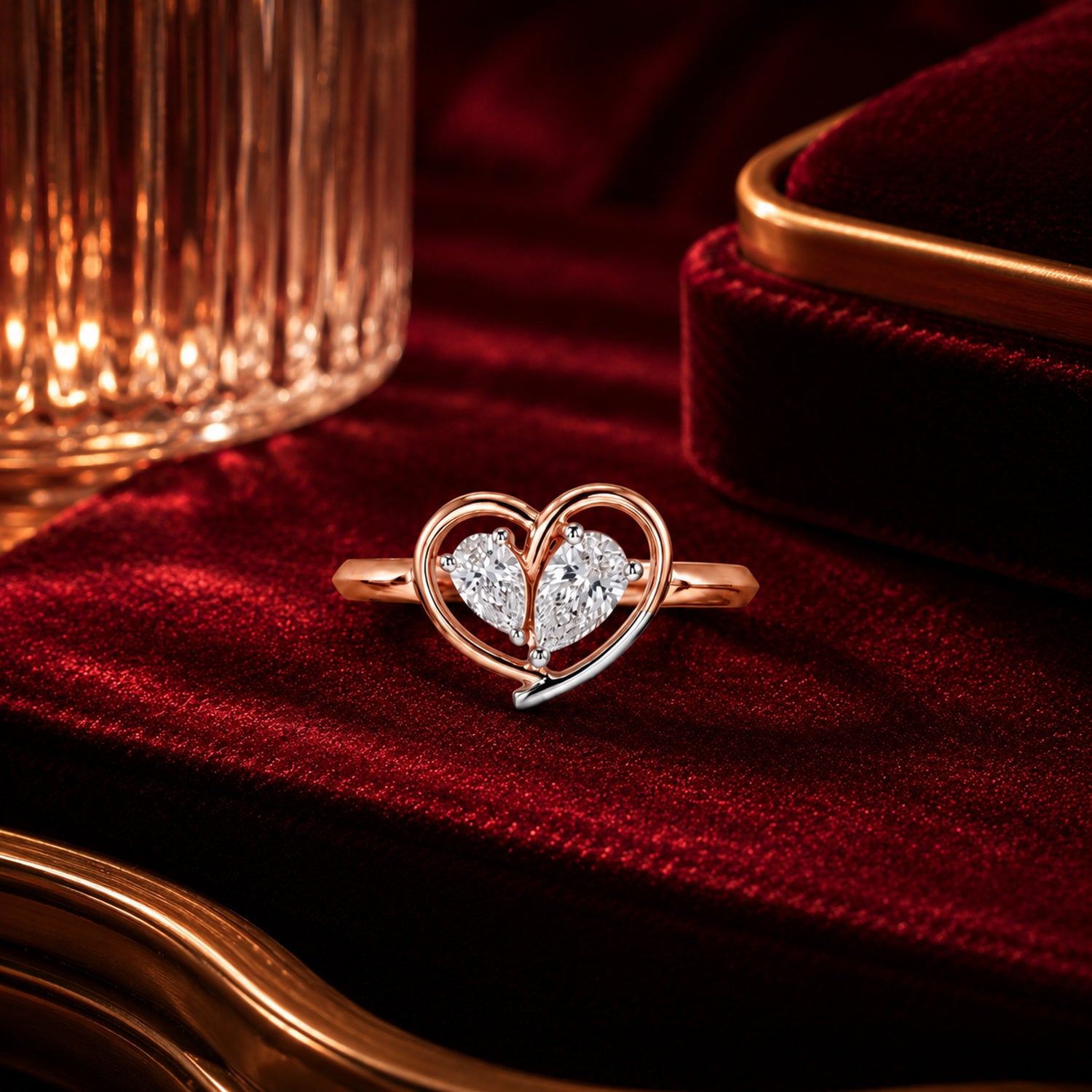 Heart-shaped lab-grown diamond ring in rose gold on crimson velvet, luxury romantic jewellery photography by Firefly Diamonds.
