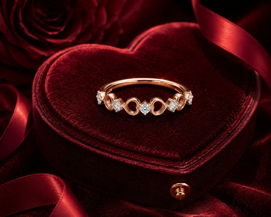 Infinity diamond band ring in rose gold with heart-shaped velvet box.